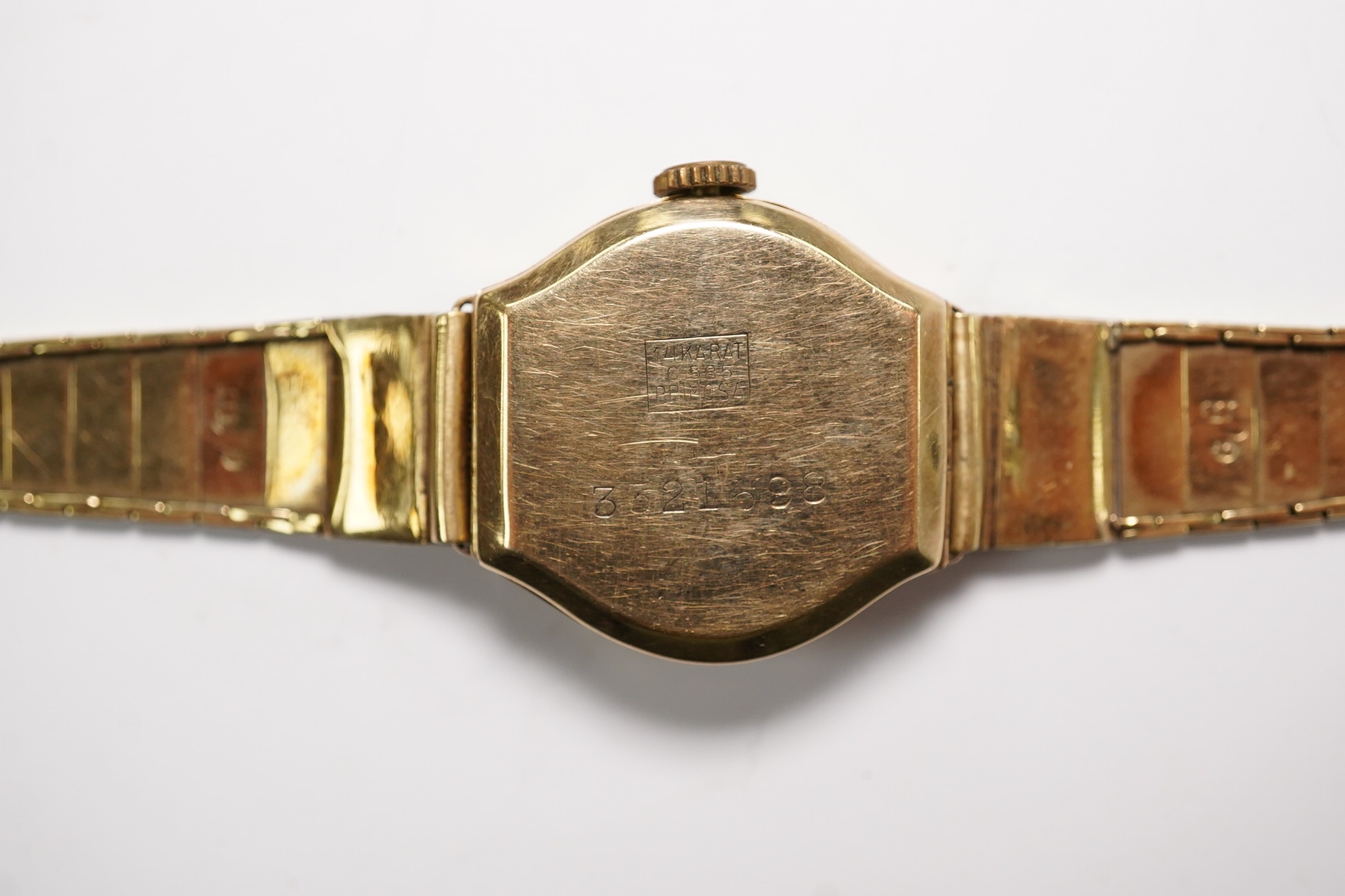 A lady's 14k manual wind wrist watch, on a 14k bracelet, gross weight 14 grams. Condition - poor to fair